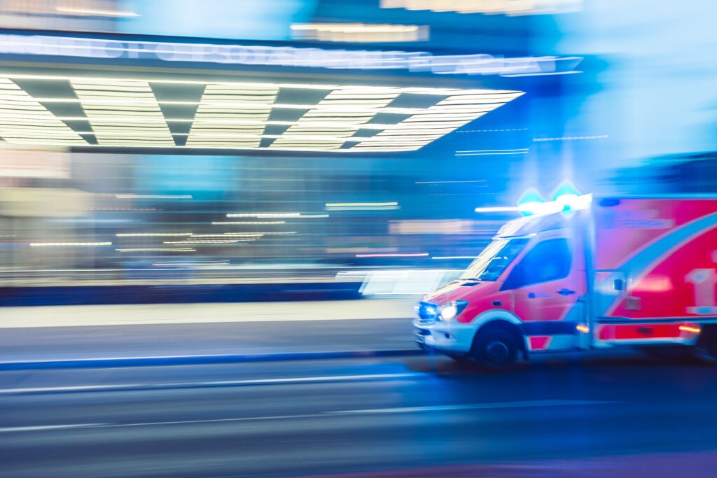 Ambulance company vehicle at night